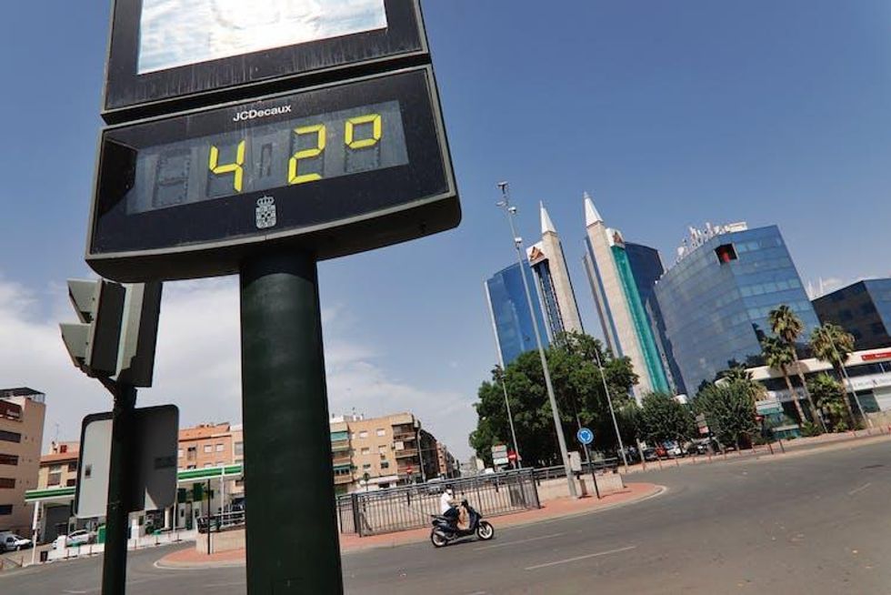 A roadside thermometer shows 42degC