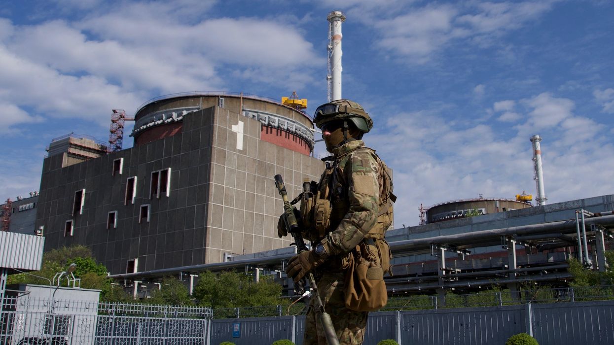 A Russian soldier patrols the territory of the Zaporizhzhia Nuclear Power Station in Energodar, Ukraine.