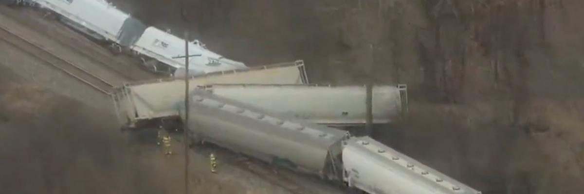 A screenshot of video footage shows a derailed train in ​Van Buren Township