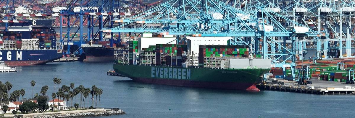 A shipping container ship is unloaded at the Port of Los Angeles