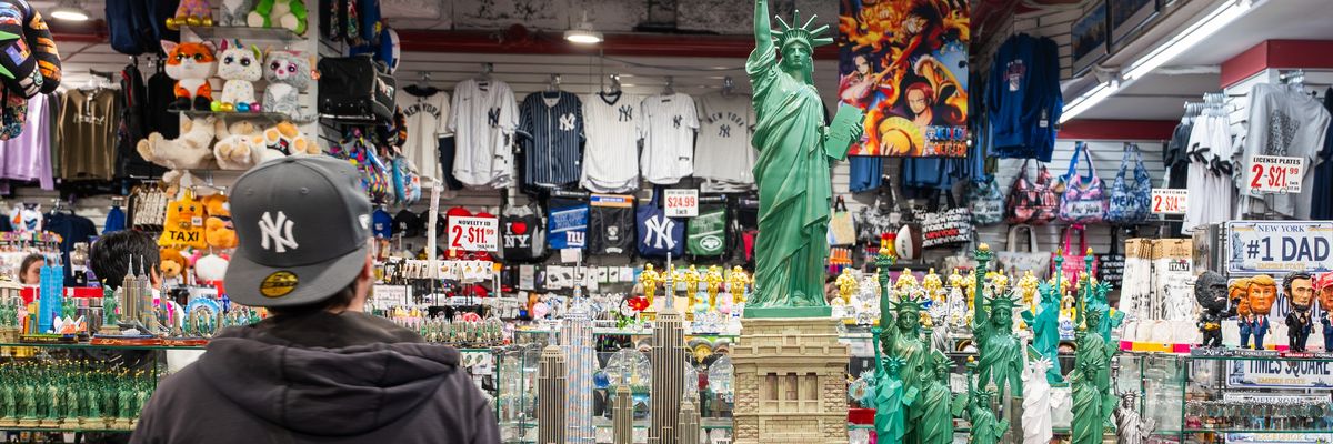 A shopper looks at Statue of Liberty replicas.