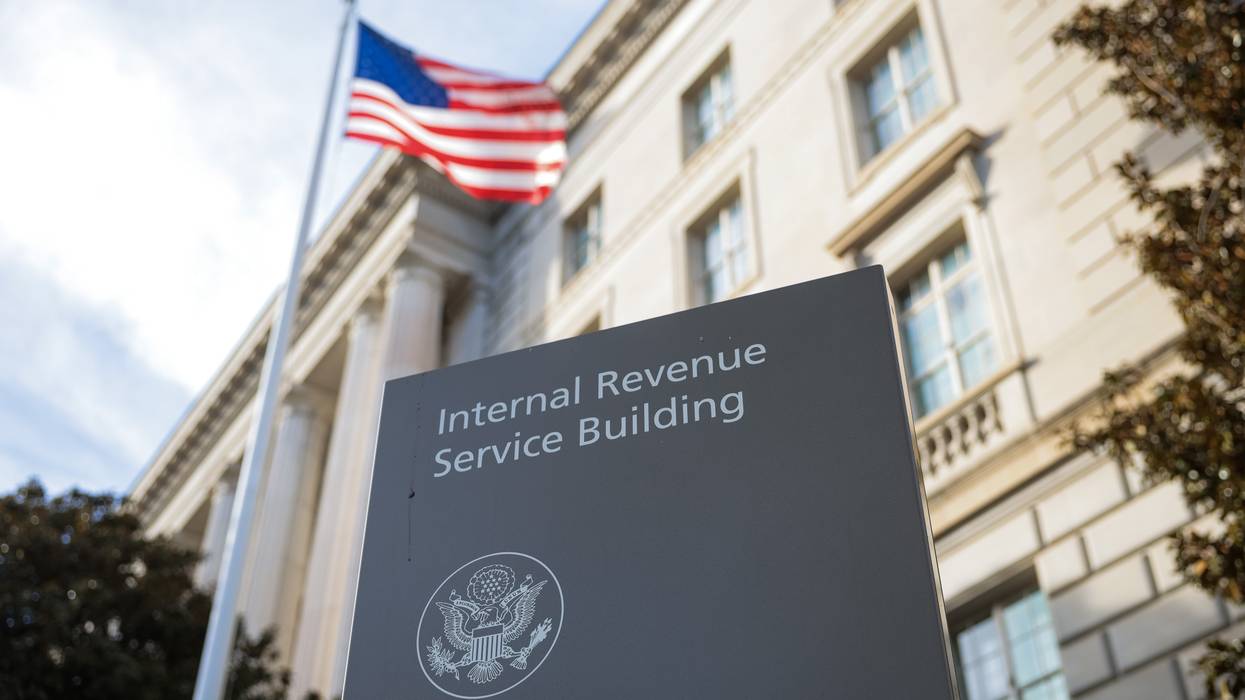A sign for the Internal Revenue Service is seen outside its building on February 13, 2025