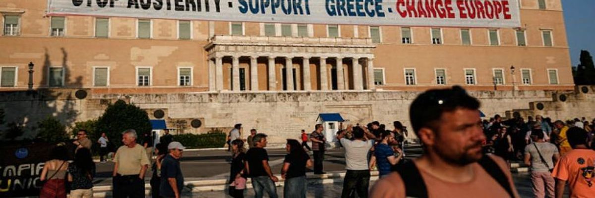 A sign hung outside the Greek parliament building