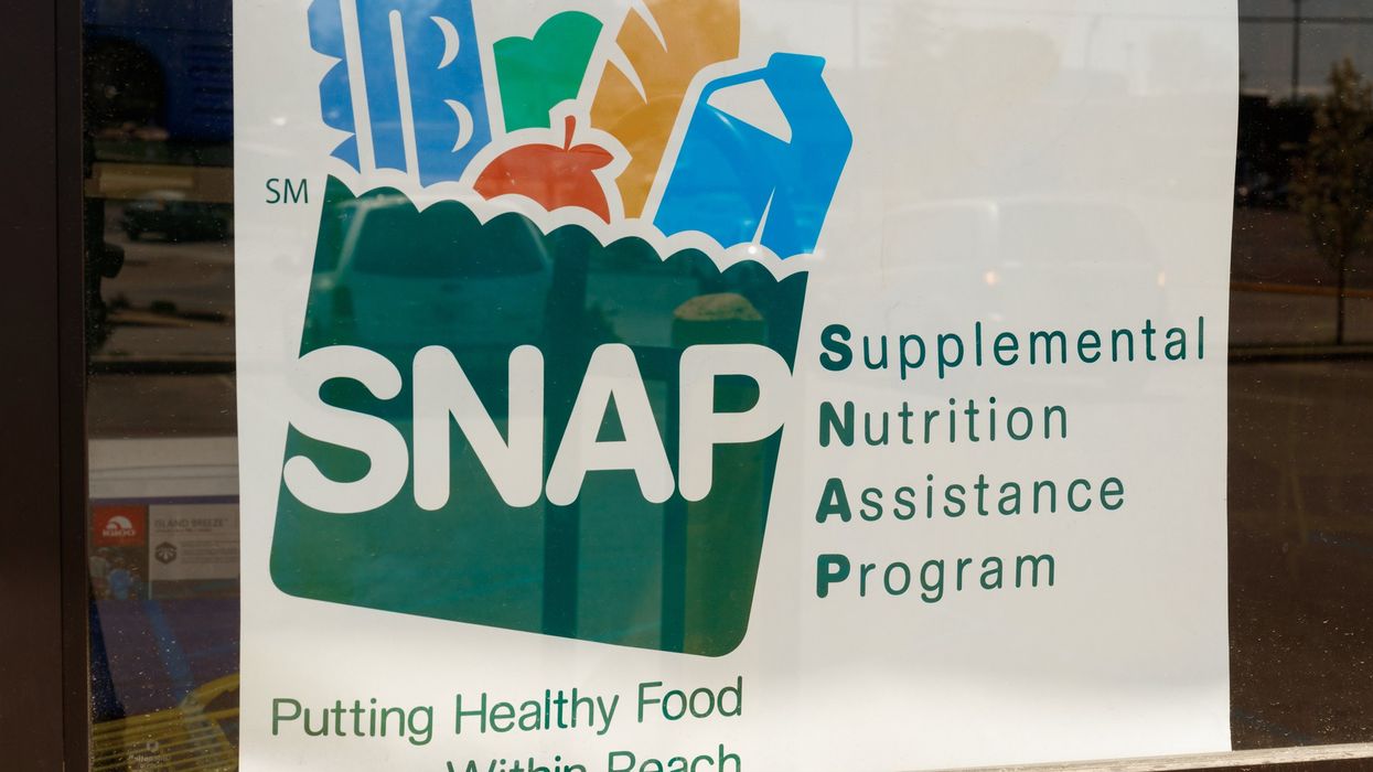 A sign in store window that indicates SNAP is accepted.
