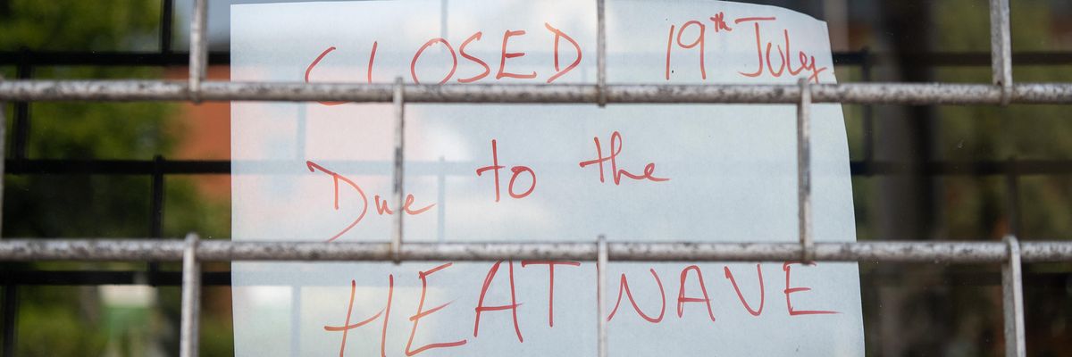 A sign indicating that a store is closed due to an ongoing heatwave is seen in London on July 19, 2022.