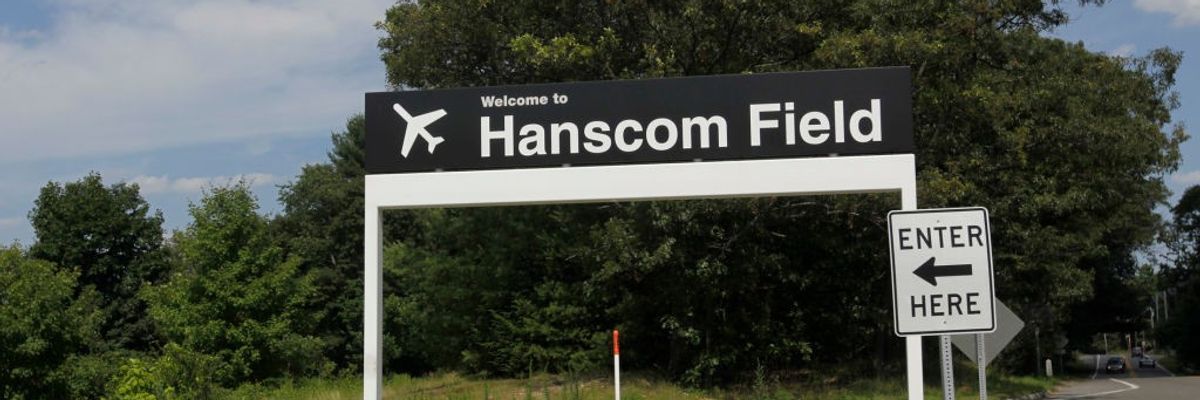 A sign points to Hanscom Field. 
