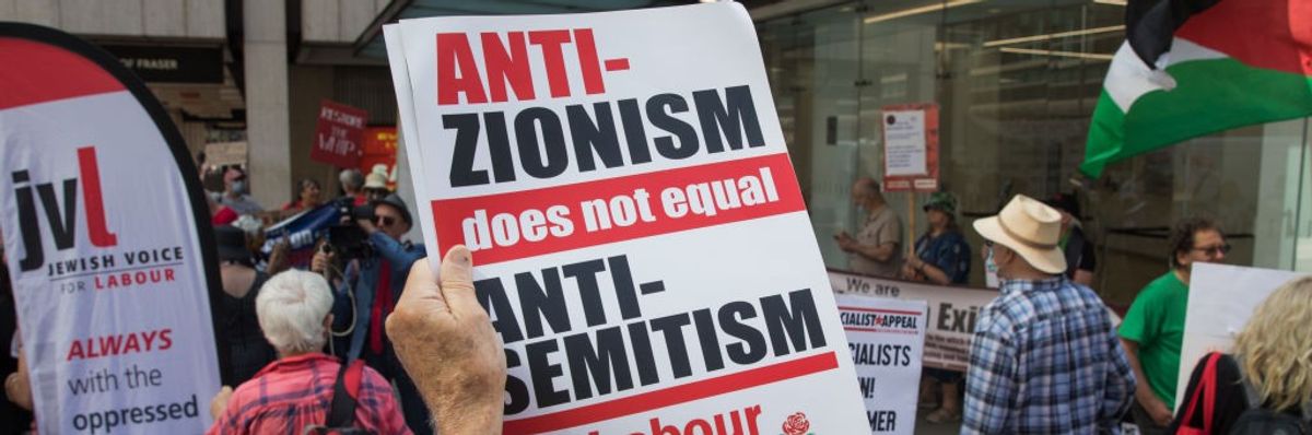 A sign reading "Anti-Zionism does not equal antisemitism"