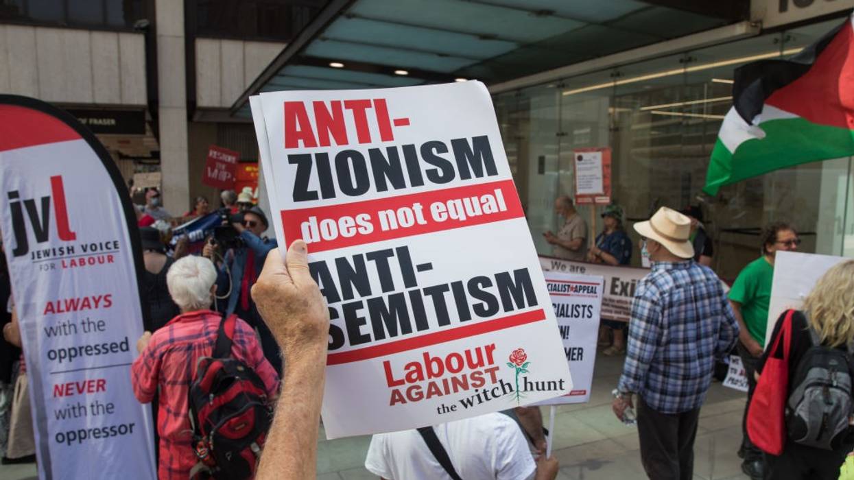 A sign reading "Anti-Zionism does not equal antisemitism"