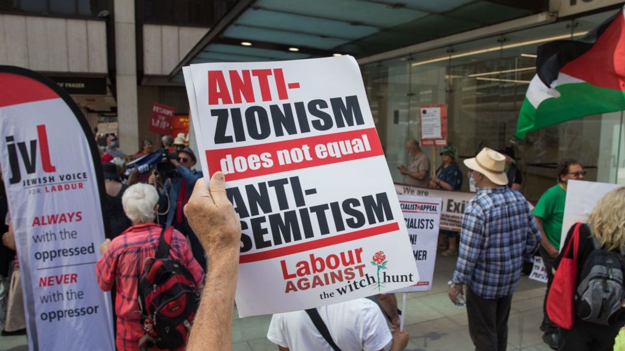 A sign reading "Anti-Zionism does not equal antisemitism"