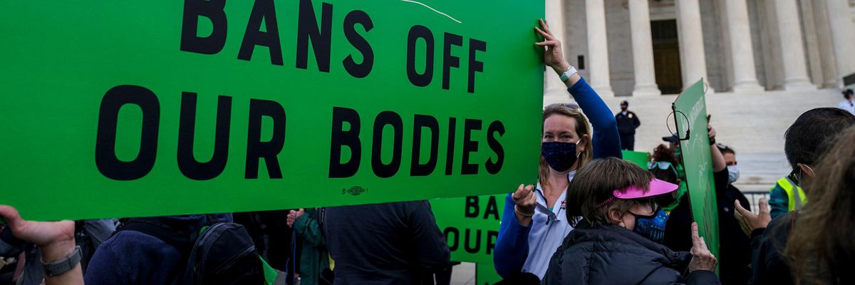A sign reading "Bans off our bodies" at a pro-choice rally
