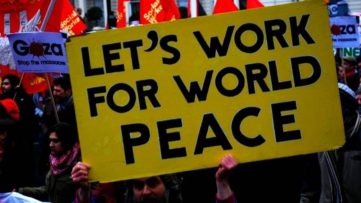 A sign reading "Let's Work For World Peace"