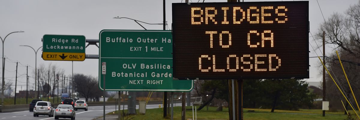 A sign reads "All Bridges to CA Closed."