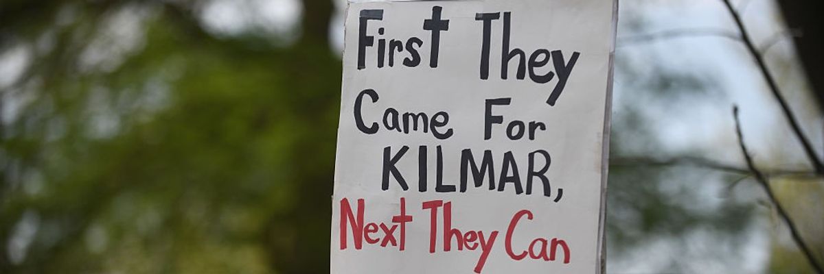 A sign reads, "First they came for Kilmar, next they can come for you."