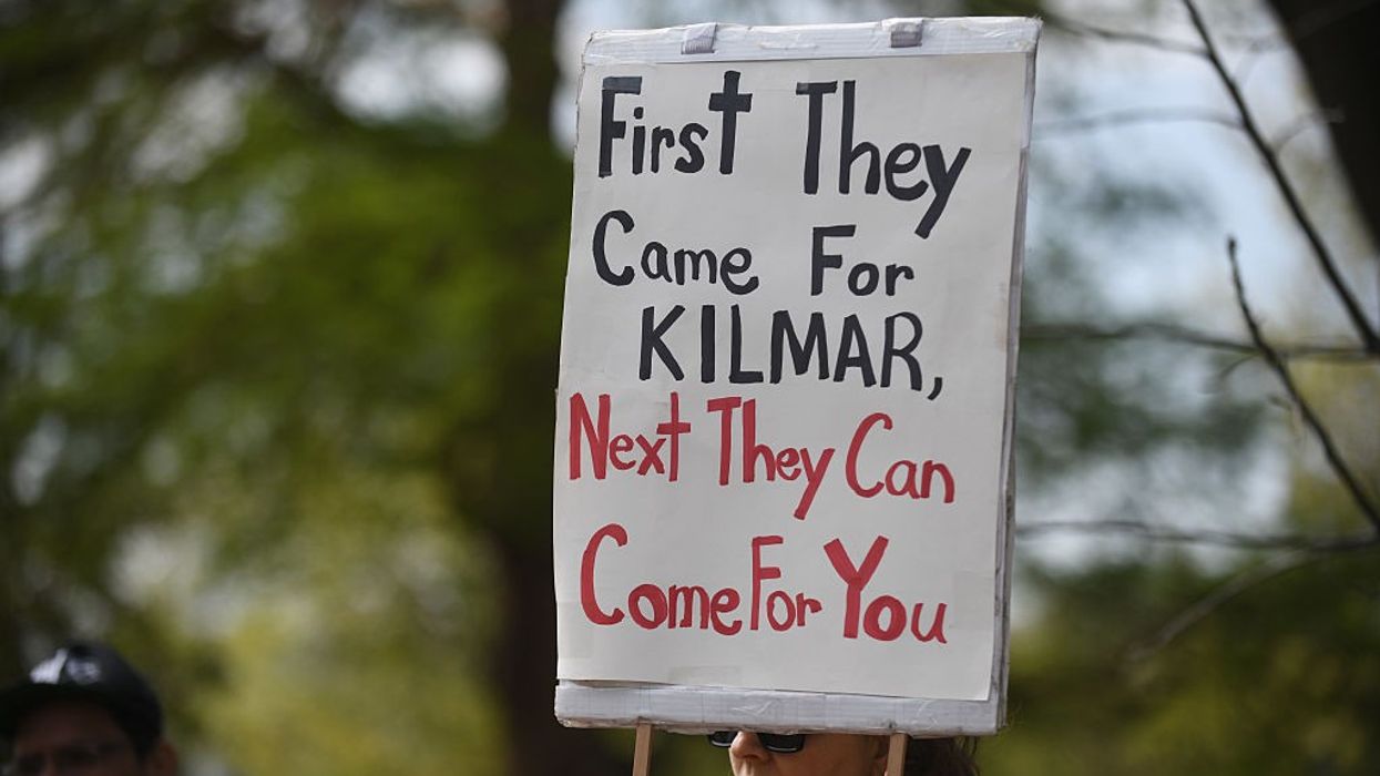 A sign reads, "First they came for Kilmar, next they can come for you."