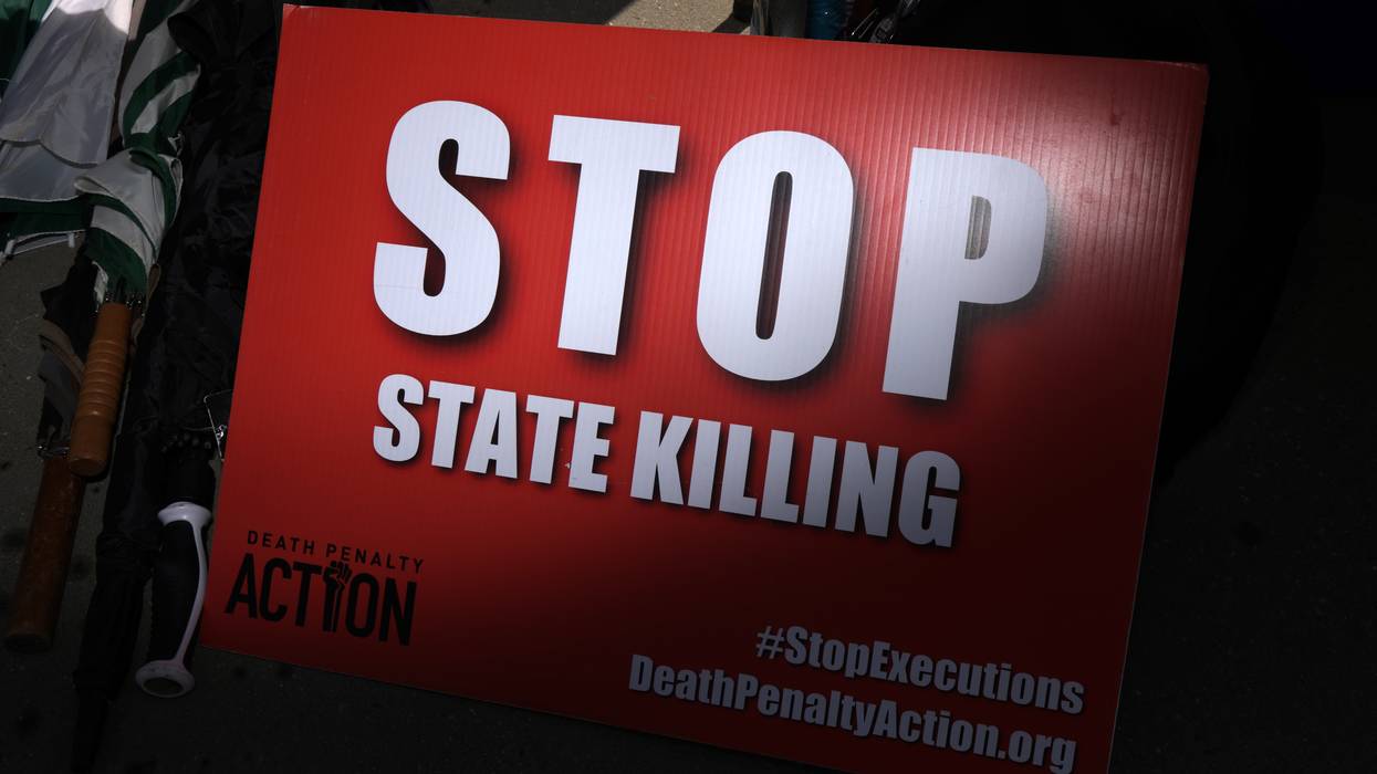 A sign reads "Stop State Killing."