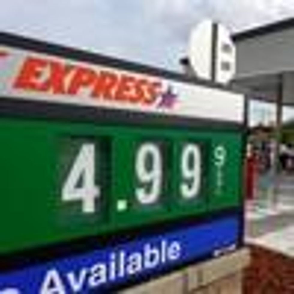 A sign reflects the price per gallon of fuel at a gas station on March 10, 2022 in Miami.