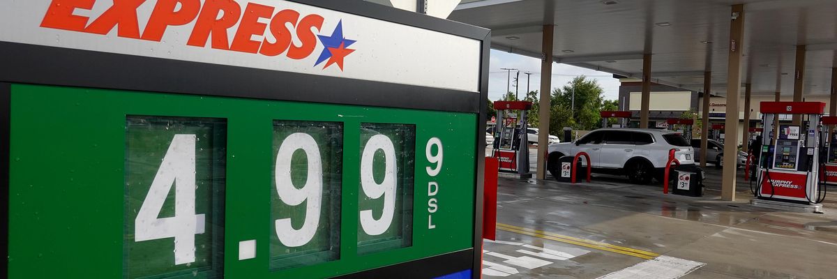 A sign reflects the price per gallon of fuel at a gas station on March 10, 2022 in Miami.