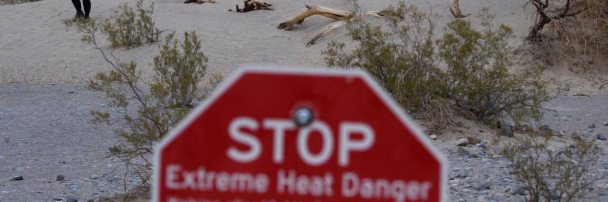 A sign saying "Stop, extreme heat danger" in Death Valley National Park