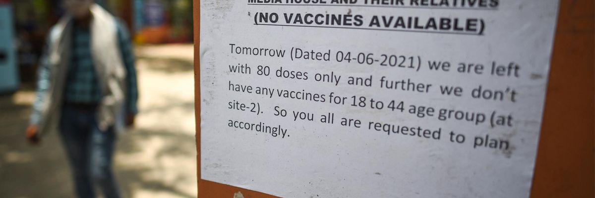 A sign says vaccines are unavailable at a center in New Delhi, India