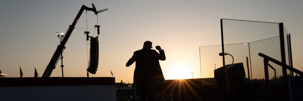 A silhouette of Trump posing to a crowd.