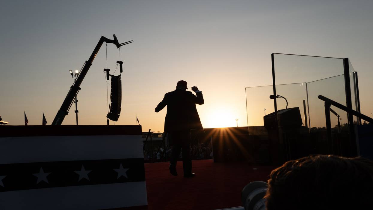 A silhouette of Trump posing to a crowd.