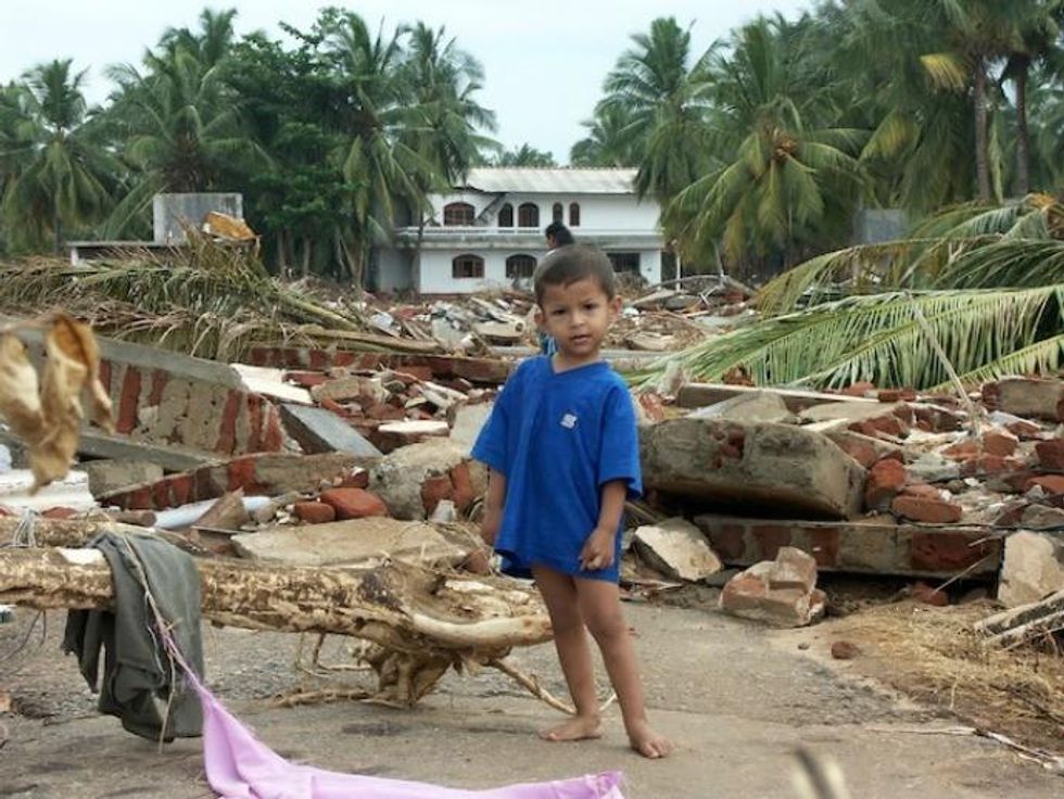 A small child stands amidst the destruction in the town of Hambantota, located in southern Sri Lanka. (Photo: Amantha Perera/IPS)