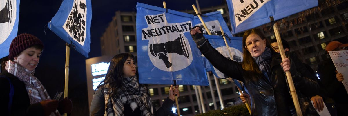 A small group of people supporting net neutrality protest against the proposals of then-Federal Communications Commission Chair Ajit Pai on December 7, 2017, in Washington, D.C.