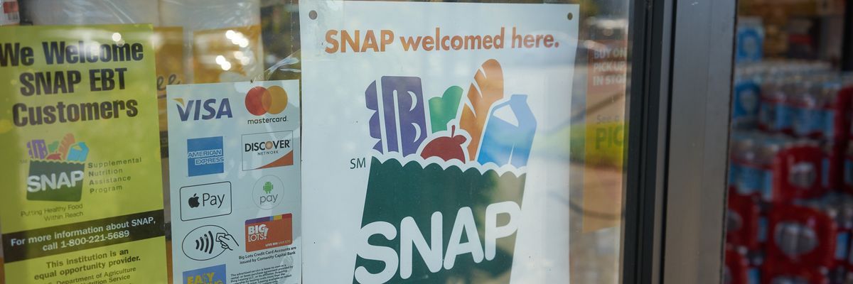 A "SNAP welcomed here" sign is displayed at the entrance to a Big Lots store in Portland, Oregon.