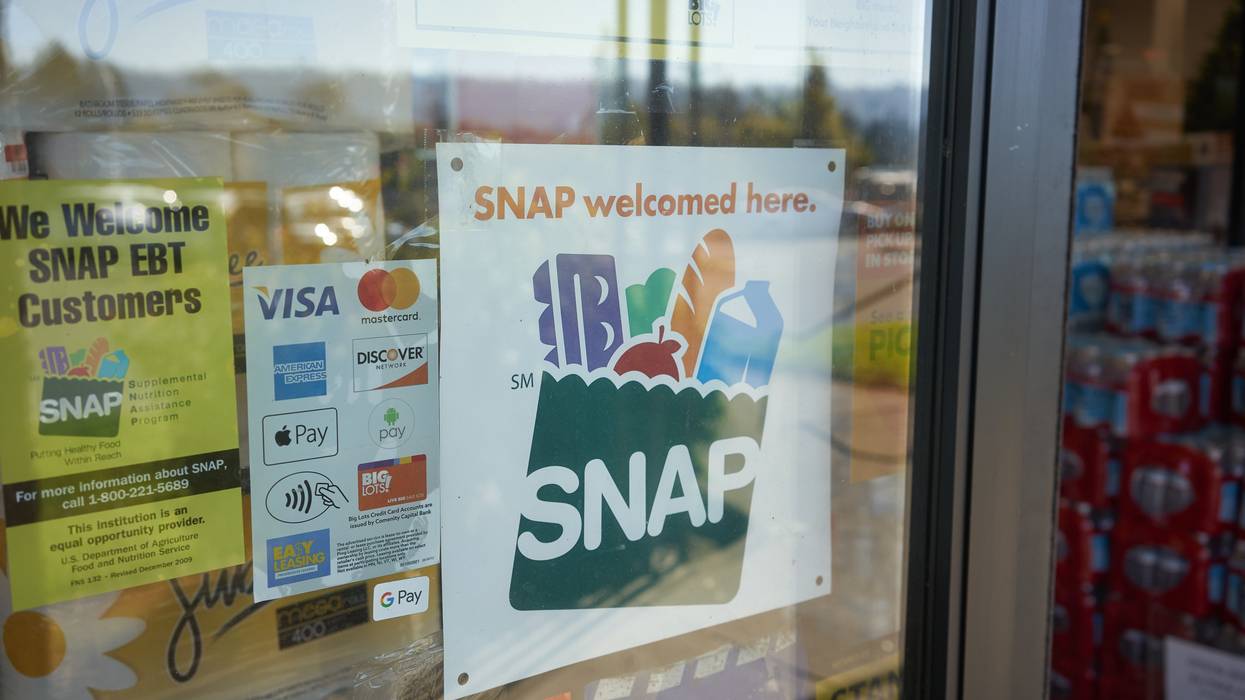 A "SNAP welcomed here" sign is displayed at the entrance to a Big Lots store in Portland, Oregon.