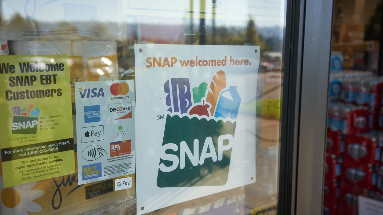 A "SNAP welcomed here" sign is displayed at the entrance to a Big Lots store in Portland, Oregon.