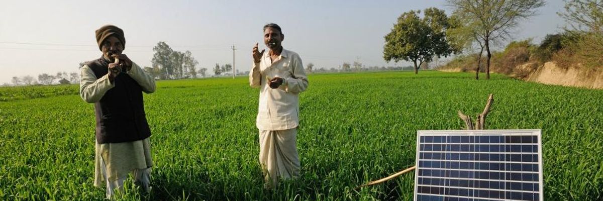 A solar panel sits in a field in Mathura, Uttar Pradesh, India