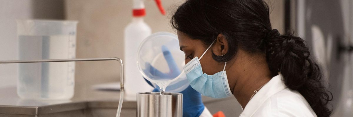 A South African researcher works in a vaccine lab