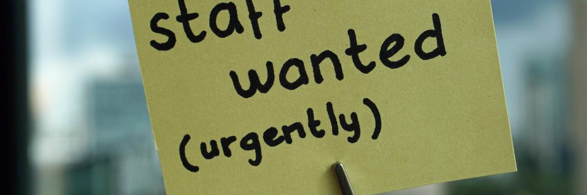 A staff wanted sign