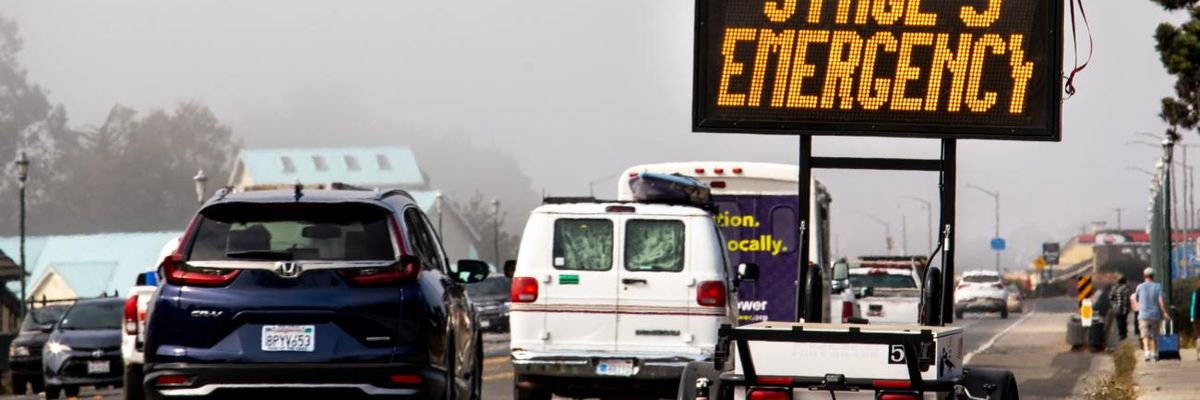 A "Stage 3 Emergency' sign is seen on a highway