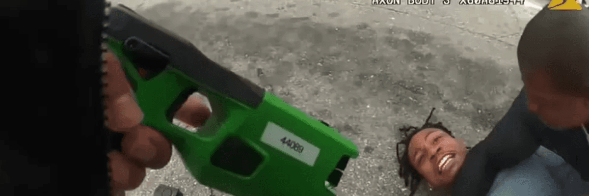 A still image from police body cam footage shows LAPD officers holding down and threatening to tase 31-year-old Keenan Anderson.