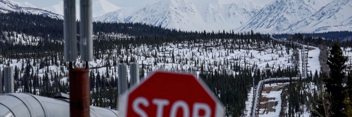A Stop sign in front of a pipeline system in Alaska.