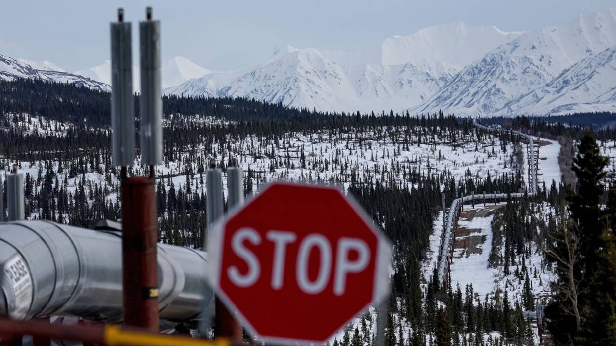 A Stop sign in front of a pipeline system in Alaska.