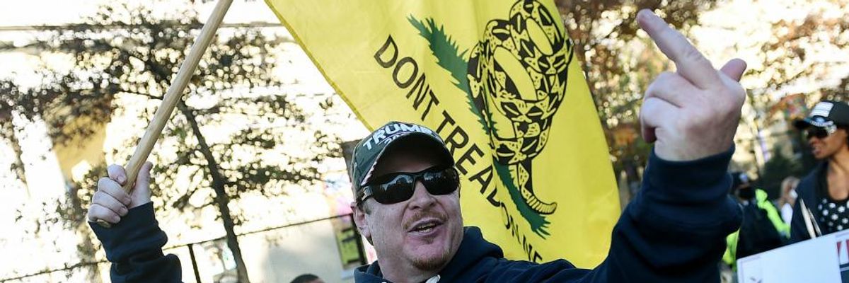 A supporter of President Donald Trump insults counter-protesters during a rally in Washington, D.C., on November 14, 2020