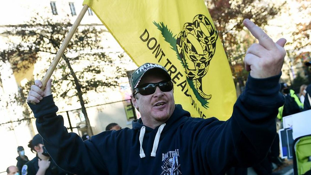 A supporter of President Donald Trump insults counter-protesters during a rally in Washington, D.C., on November 14, 2020