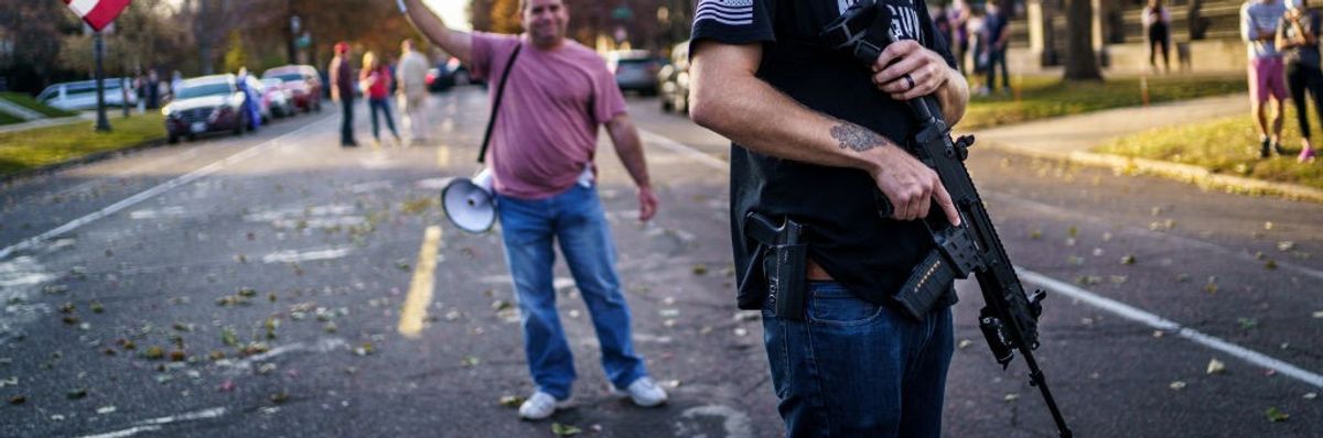 A supporter of then-President Donald Trump kept a hand on his gun in 2020