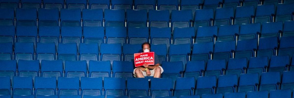 A supporter sits alone in the top sections of seating as Vice President Mike Pence speaks before President Donald J. Trump arrives for a "Make America Great Again!" rally at the BOK Center on Saturday, June 20, 2020 in Tulsa, OK