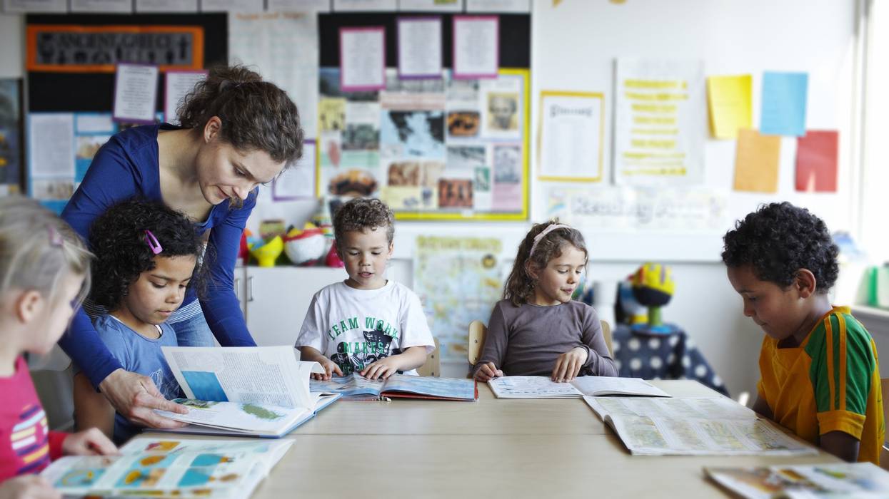 A teacher reads with students