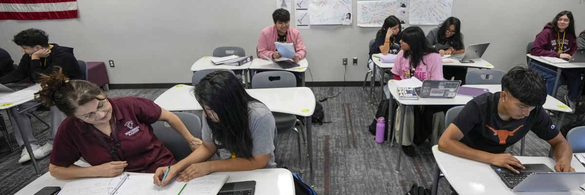 A teacher works with students at Northbrook High School in the Spring Branch Independent School District