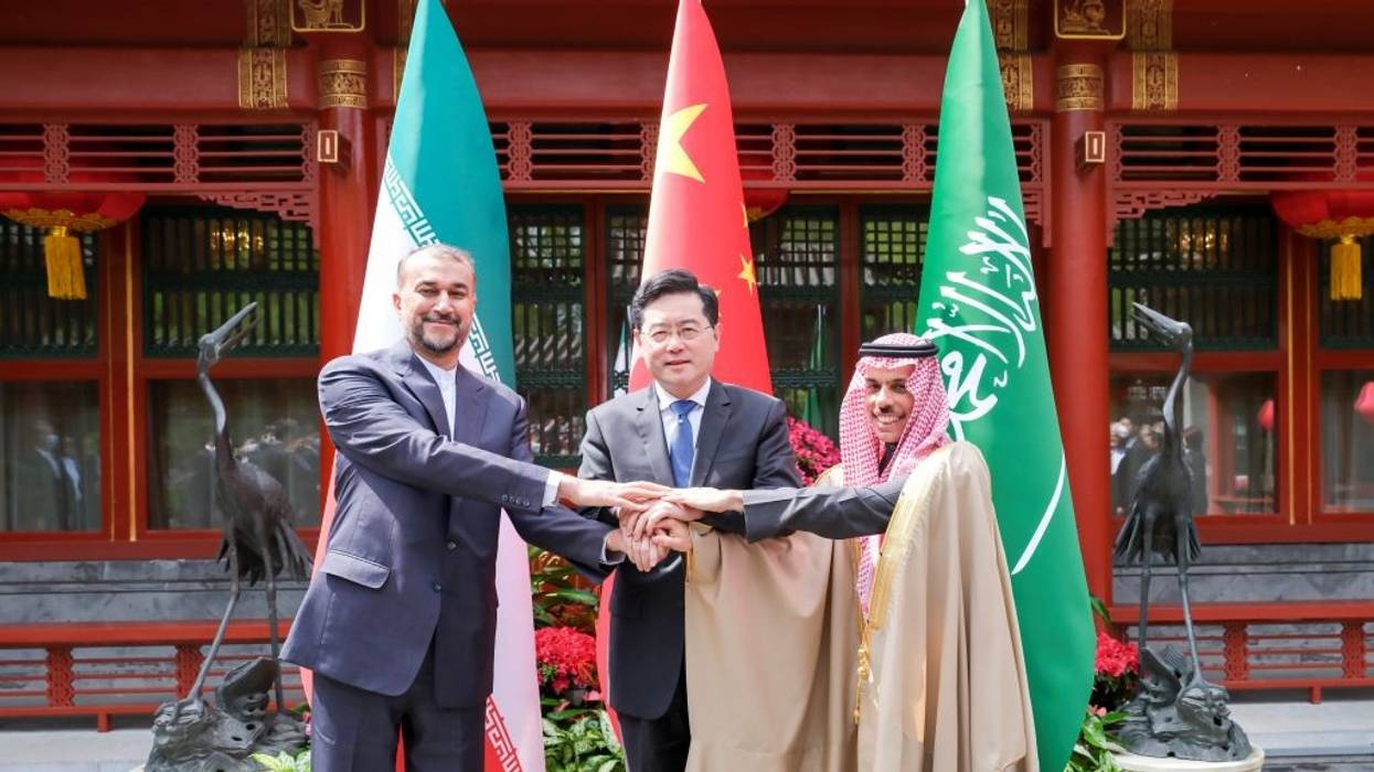 A three-way handshake between Chinese State Councilor and Foreign Minister Qin Gang meets with Saudi Arabian Foreign Minister Prince Faisal bin Farhan Al Saud and Iranian Foreign Minister Hossein Amir-Abdollahian.