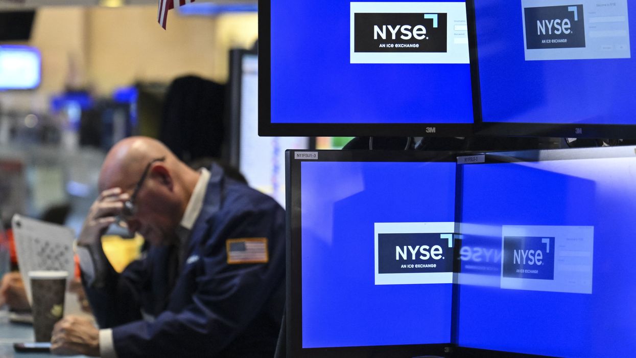 A trader with forehead in hand.