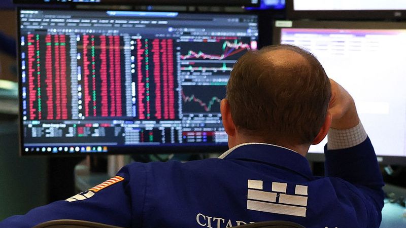 A trader works on the floor of the New York Stock Exchange