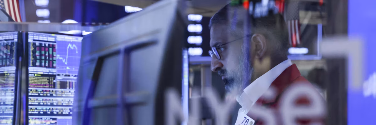 A trader works on the NYSE during Trump's Iran war.