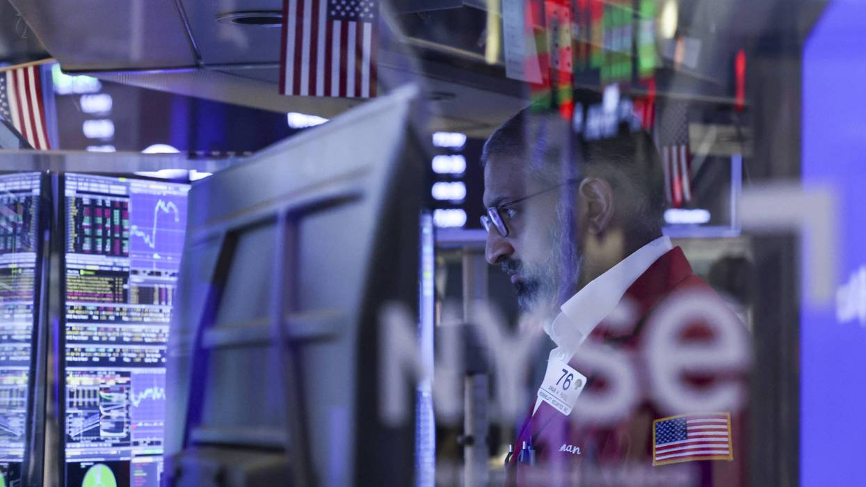 A trader works on the NYSE during Trump's Iran war.