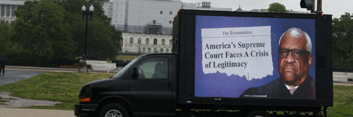 A truck commissioned by government watchdog Accountable.US displays a poster with Justice Clarence Thomas'