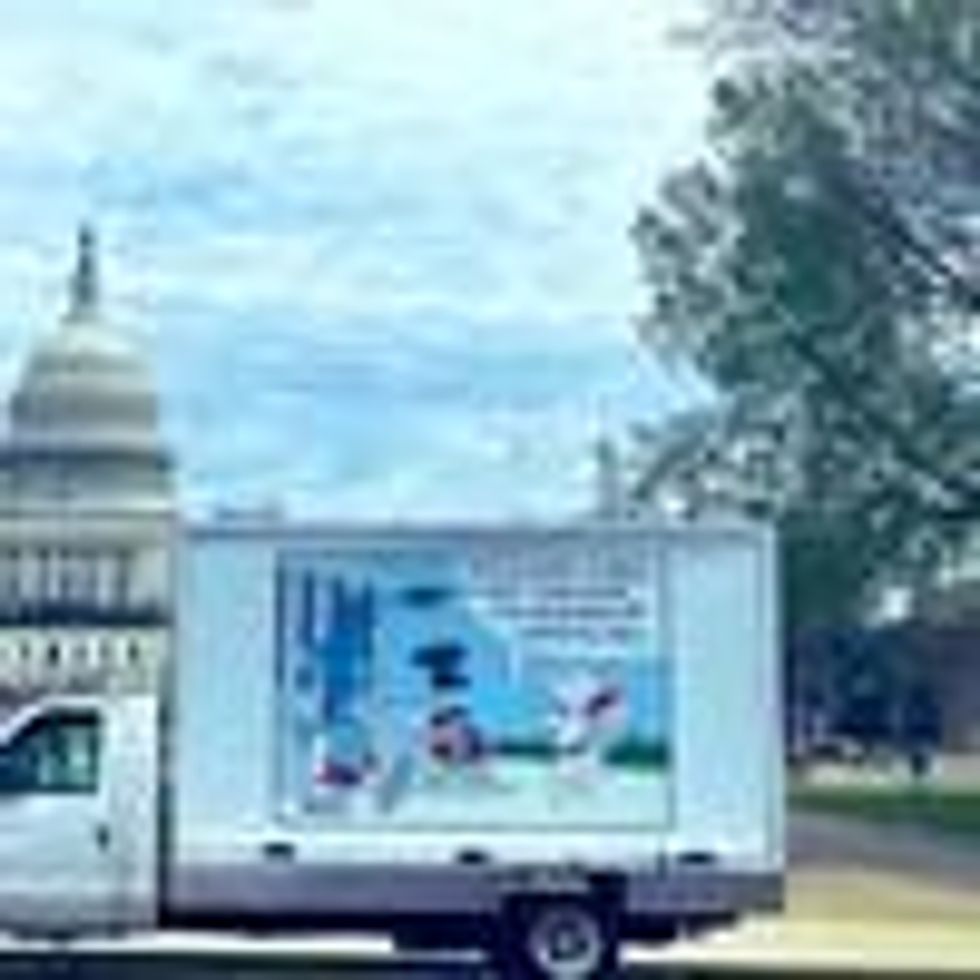 A truck displays a cartoon on Antitrust Day
